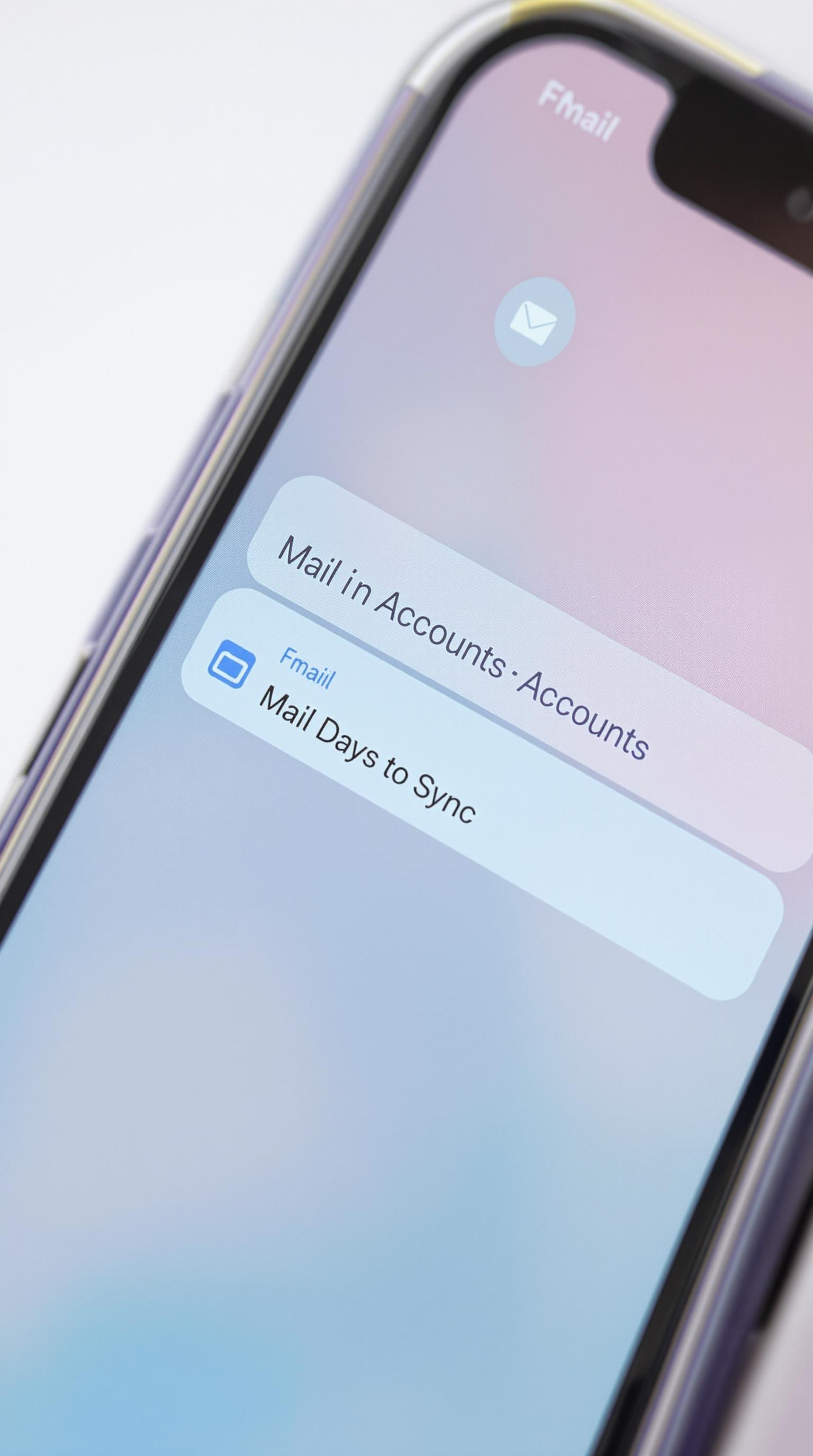 Menu Réglages > Mail > Comptes sur iPhone en teintes pastel